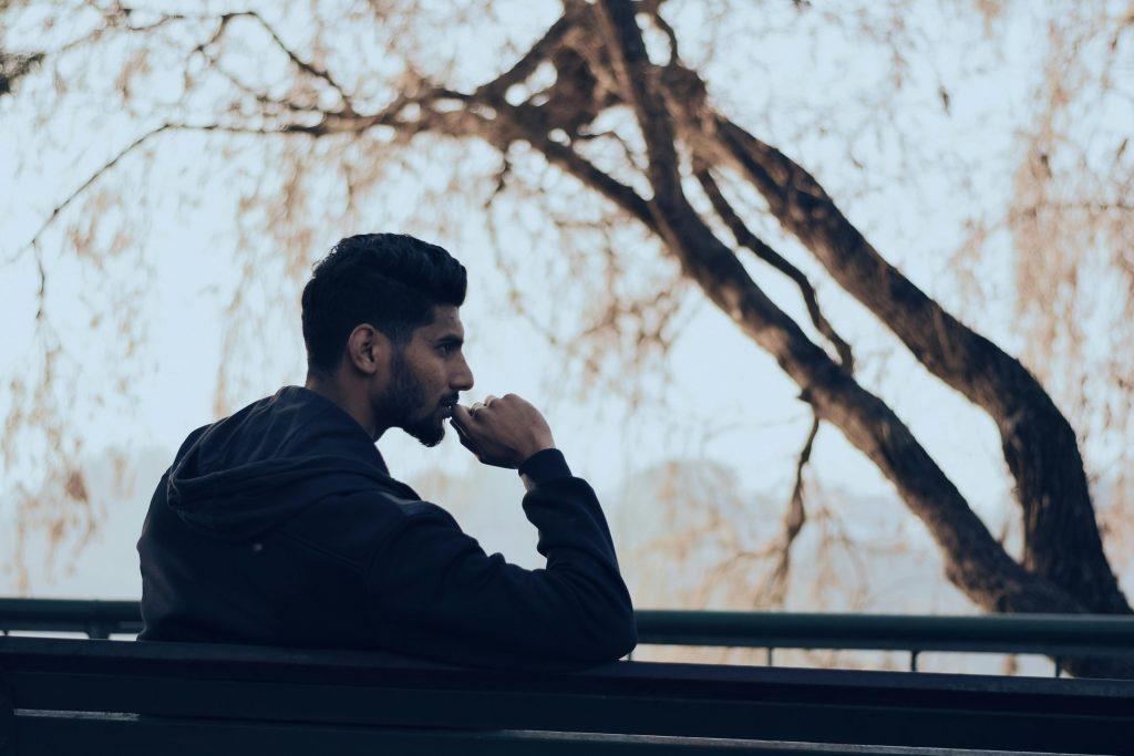 Man Thinking on Bench