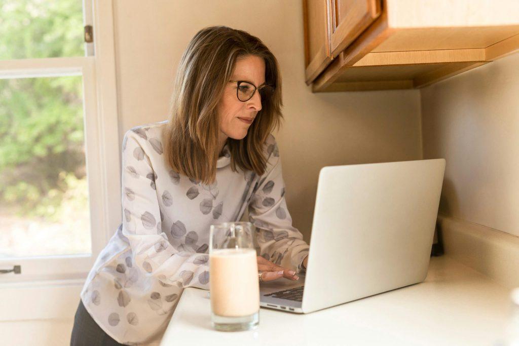 Woman using a computer on a counter