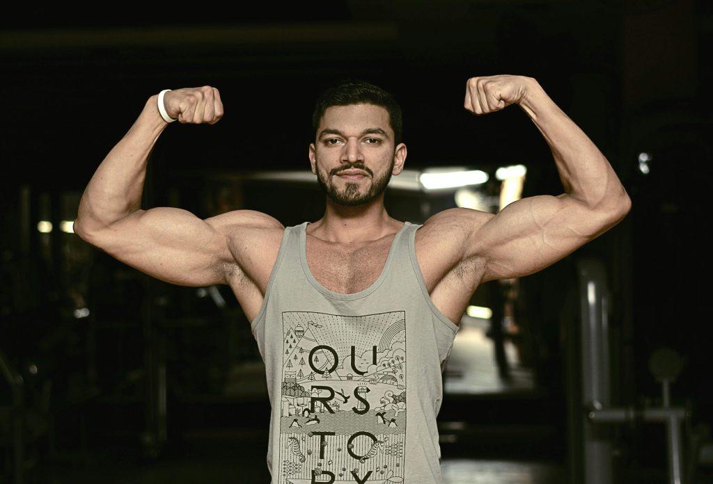 Man Flexing Muscle Gain