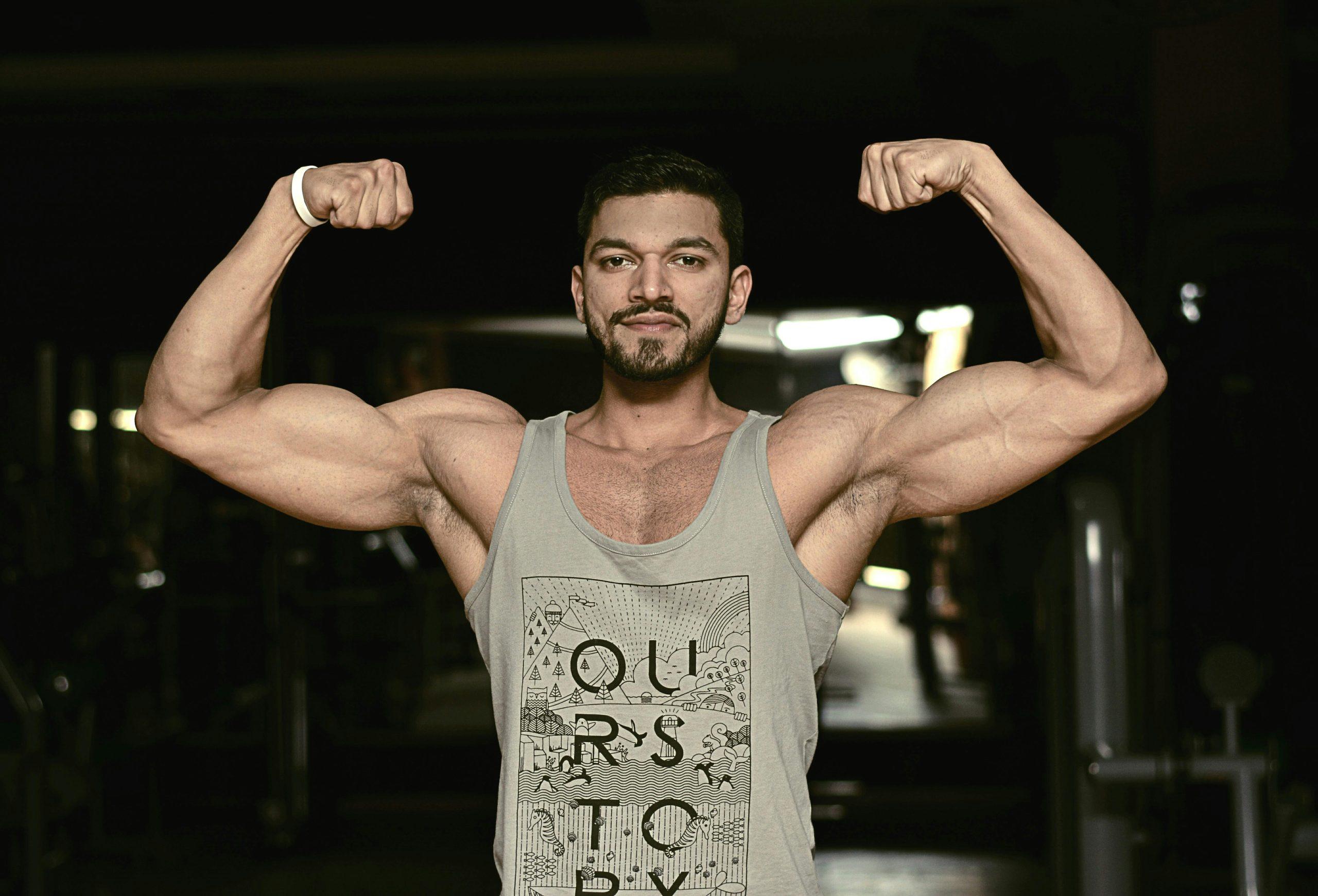 Man Flexing Muscle Gain