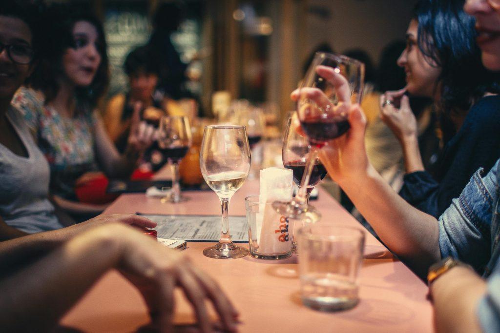 People drinking alcohol at table