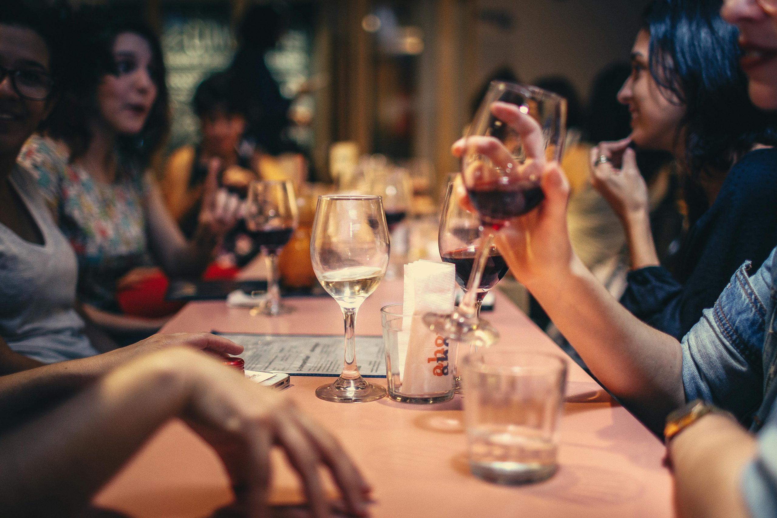 People drinking alcohol at table