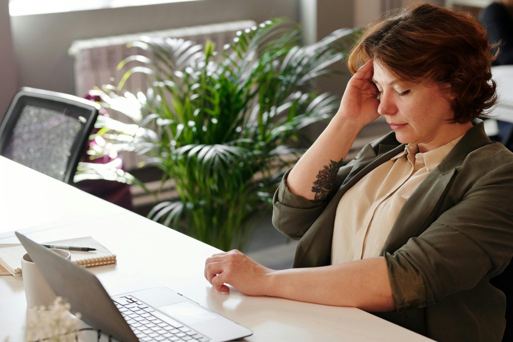 Perimenopause woman with a headache
