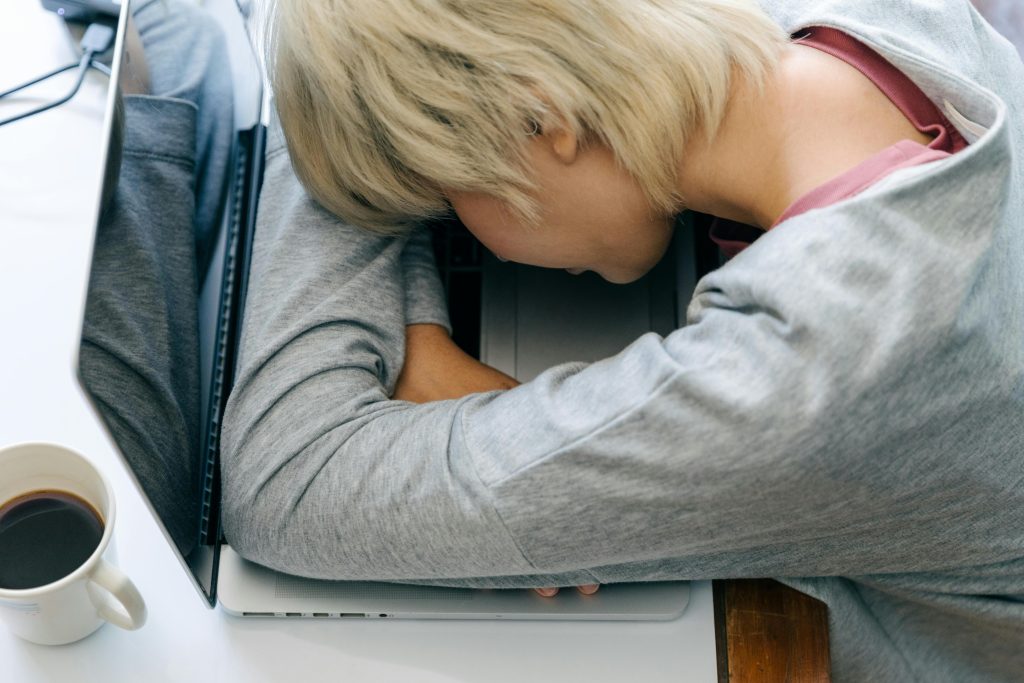 Person fallen asleep at a computer from fatigue