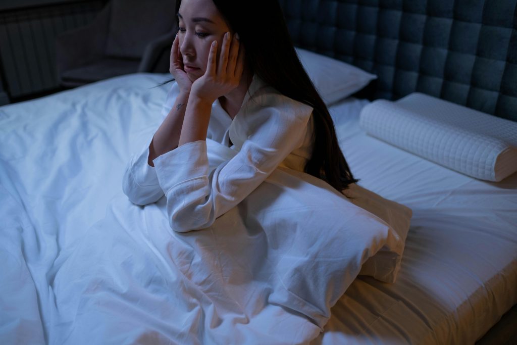 Person in bed who can't sleep
