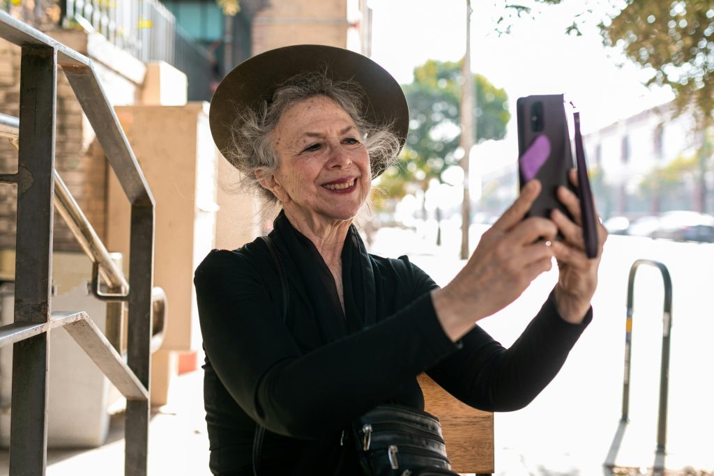 Older woman taking a selfie