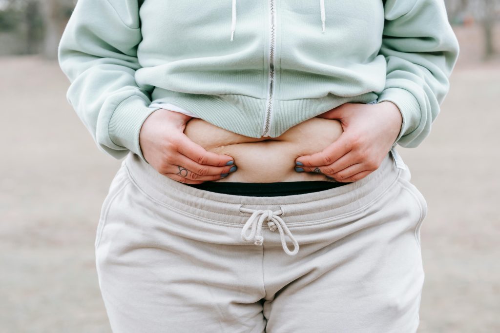 Woman holding her belly